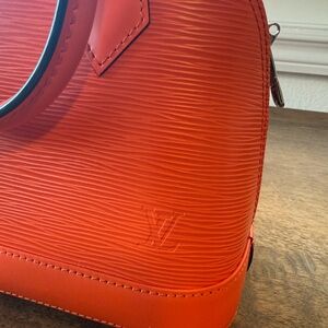 Louis Vuitton Elegant Orange Leather Handbag
